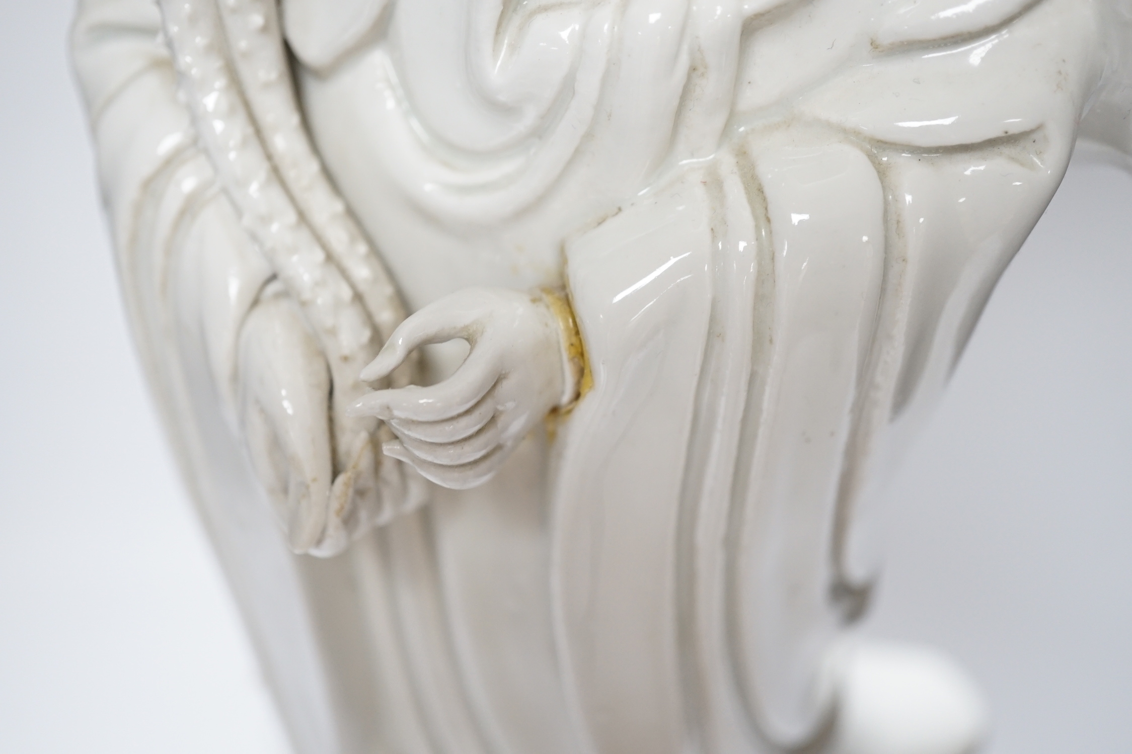 A Chinese blanc de chine figure of Guanyin, mounted as a lamp, 71cm with shade